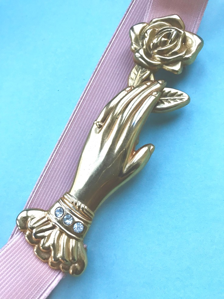 hand rose beltbuckle